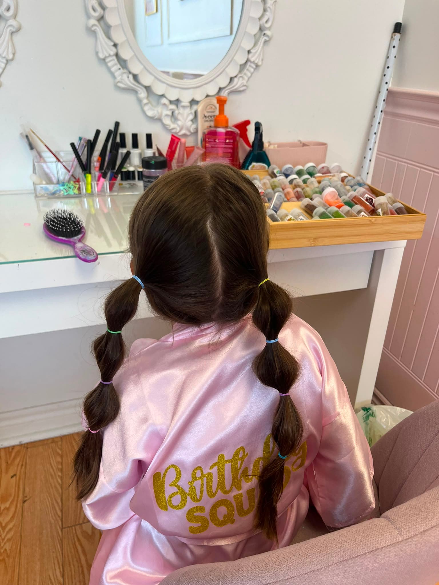 A guest enjoying colourful hair styling in the spa