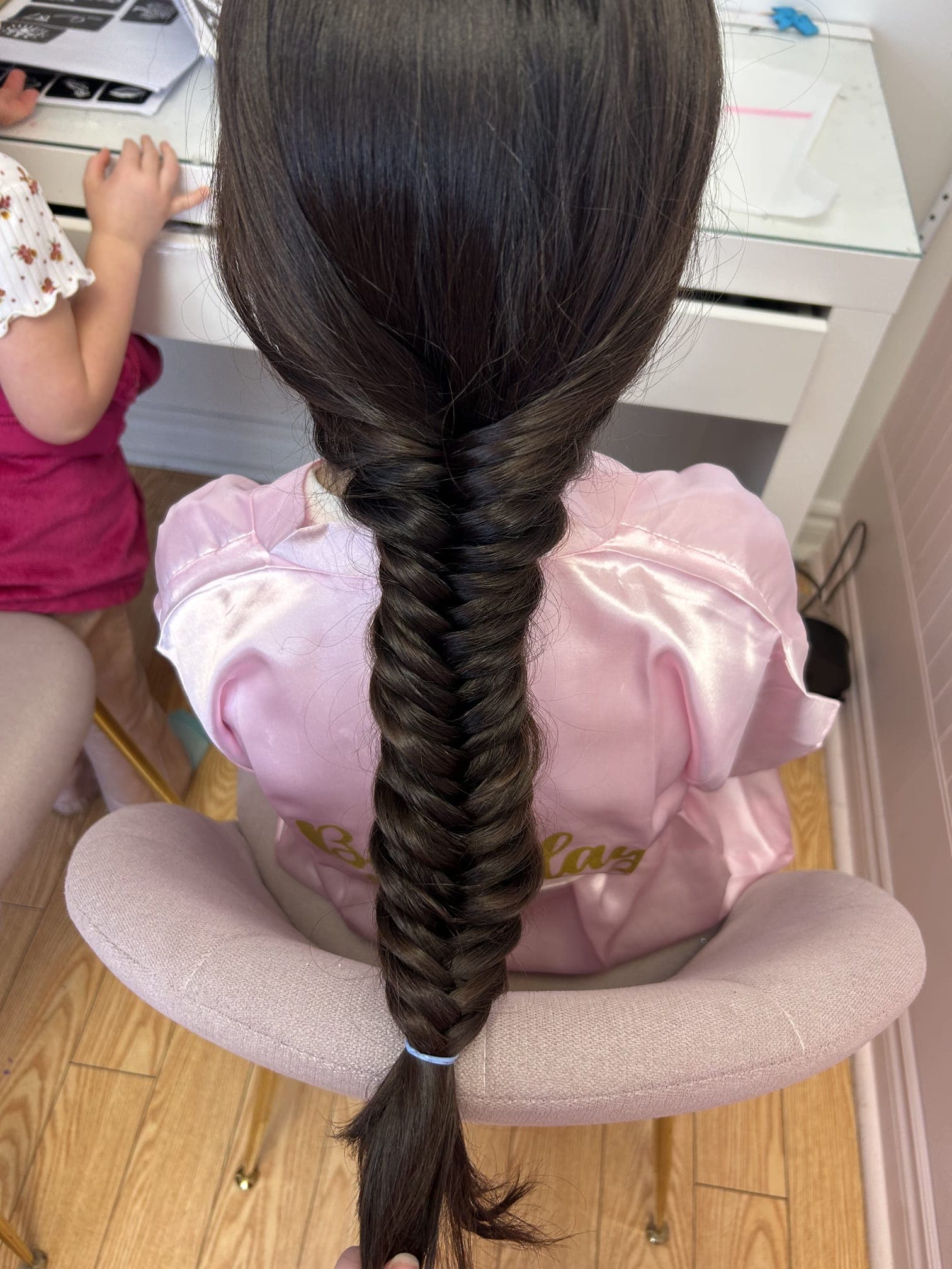A long braid styled in the Hily's Sparkly Spa chair